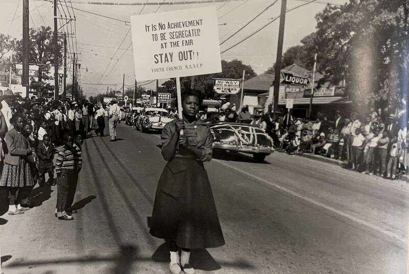 Young student with picket sign at the 1955 State Fair of Texas.