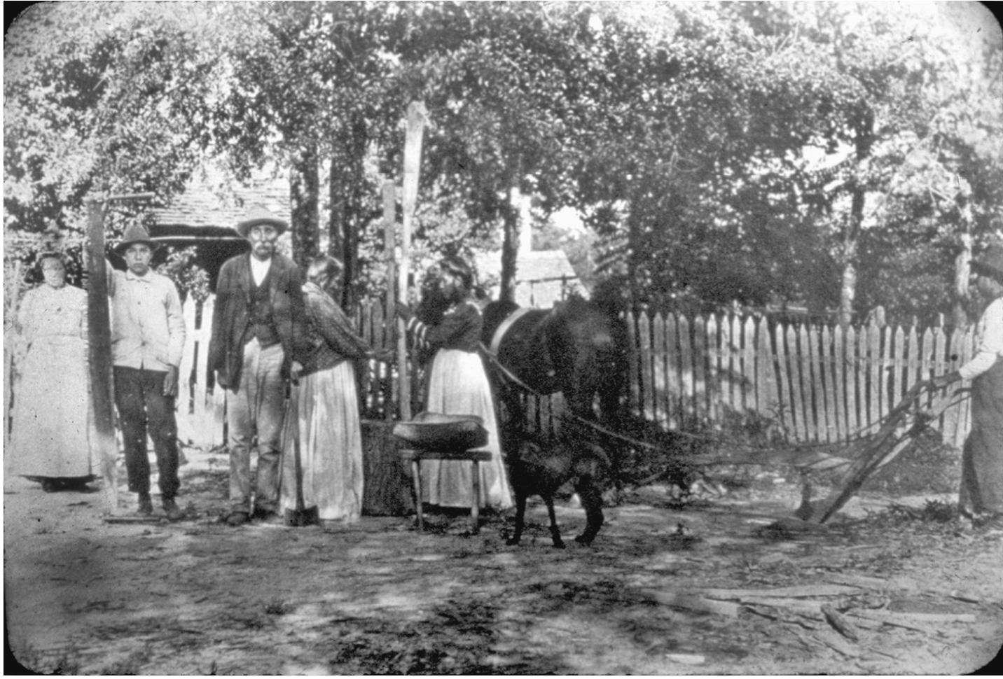 A staged photograph of George Batise and his family in 1915 on the Alabama - Coushatta reservation in East Texas.