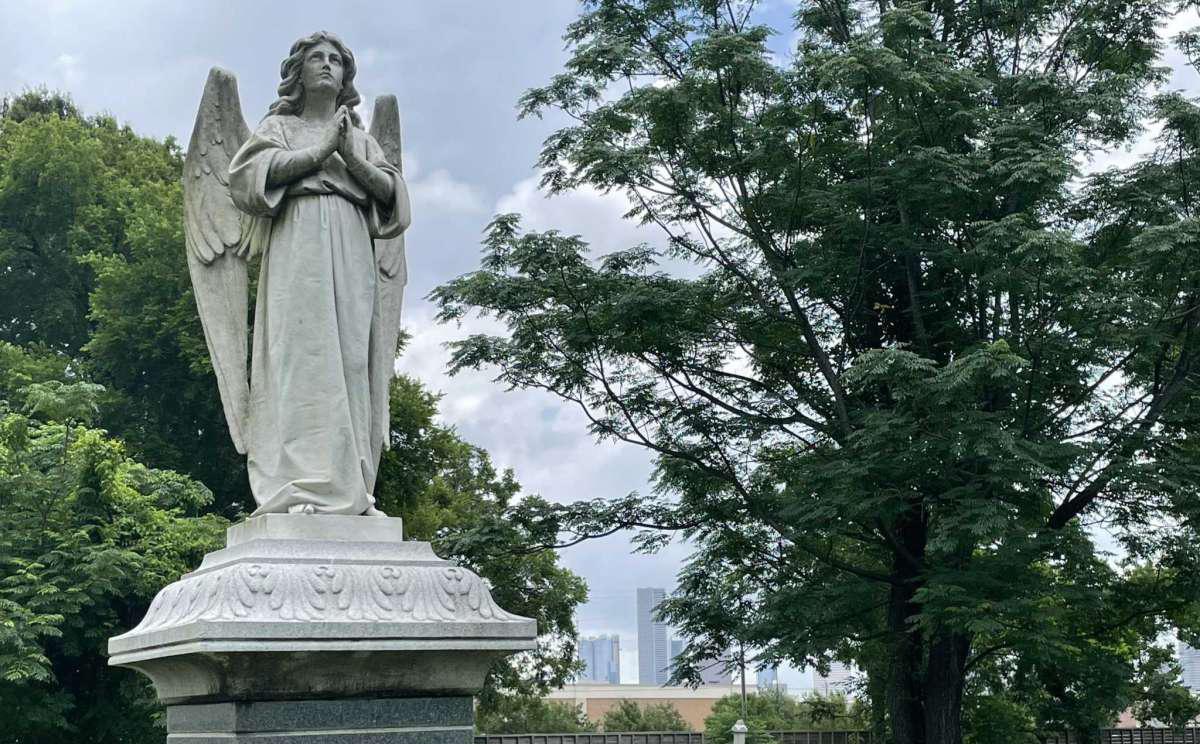 The majestic angel standing over the grave of Milton Baker has become the unofficial symbol of Olivewood Cemetery.
