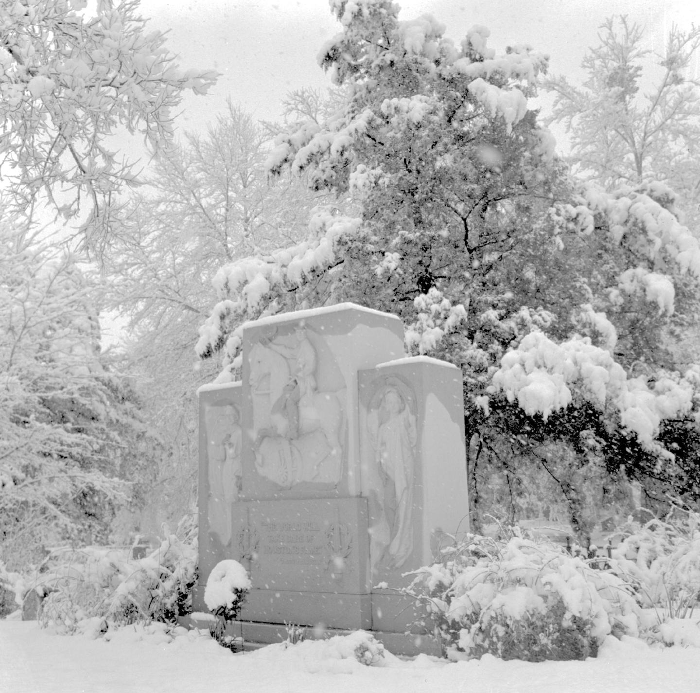 1958 image of Sam Houston's memorial grave and monument covered in snow.
