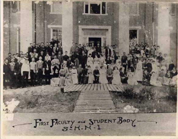 The first class and faculty of Sam Houston Normal Institute: 110 students and four teachers (in front of Austin Hall, originally Austin College).