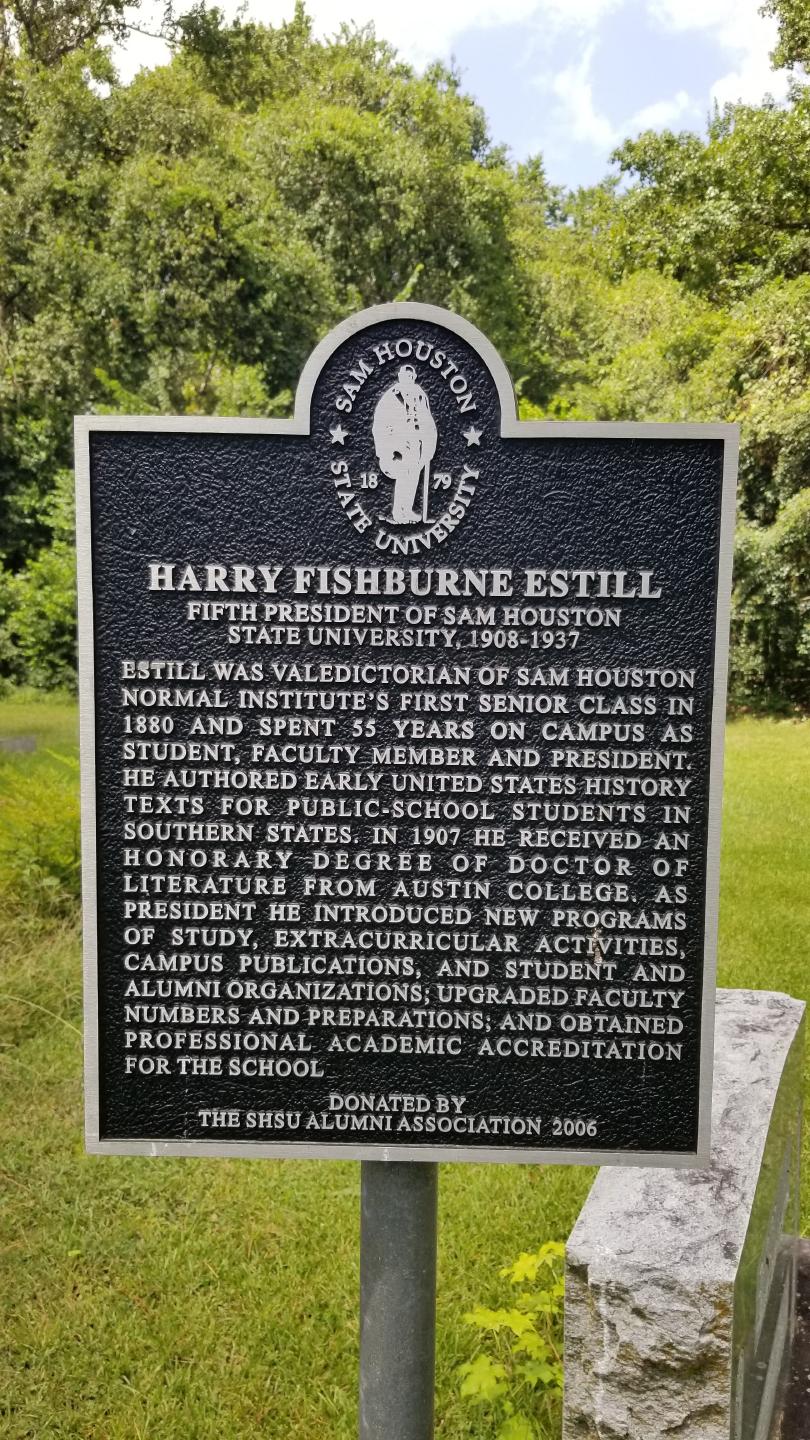 Memorial marker next to the grave of Harry F. Estill in Oakwood Cemetery in Huntsville, Texas